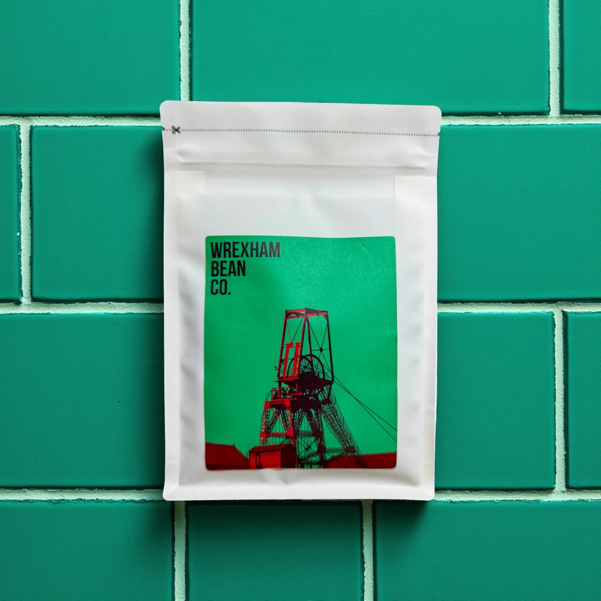 Burundi and Brazilian blend coffee lying on teal coloured tiles